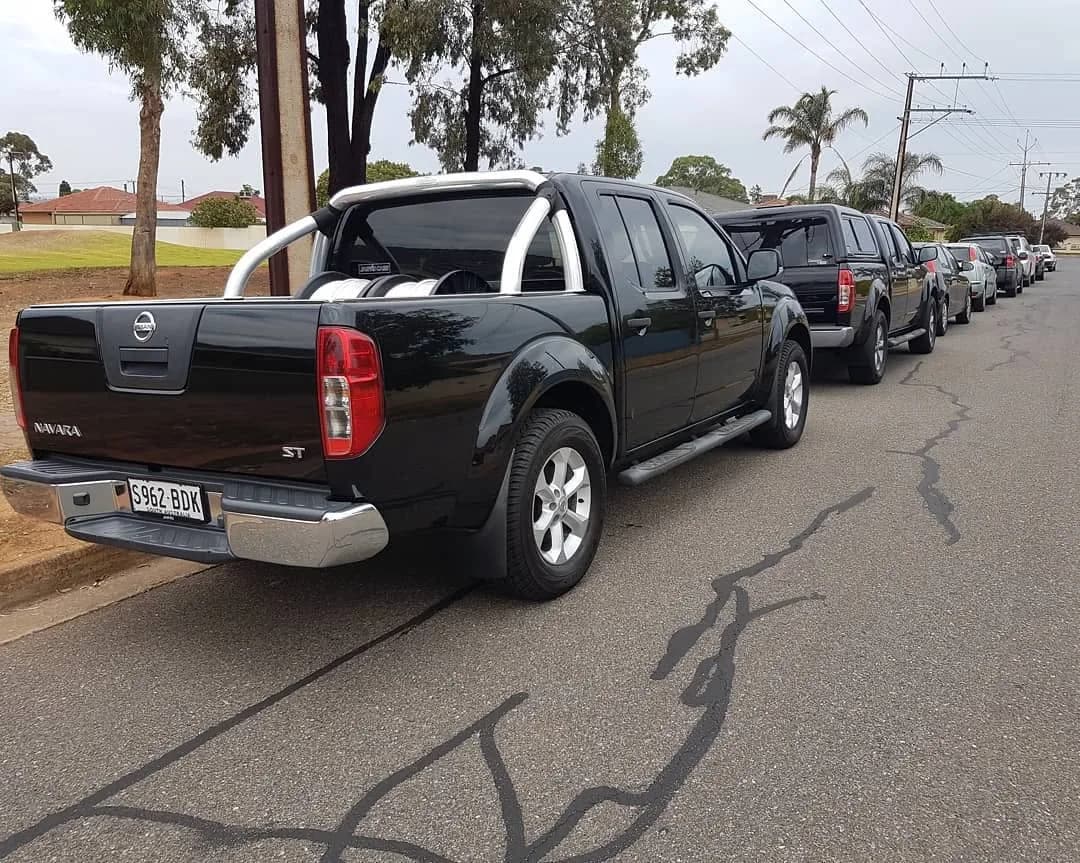 Black Nissan Navara dual cab with window tint