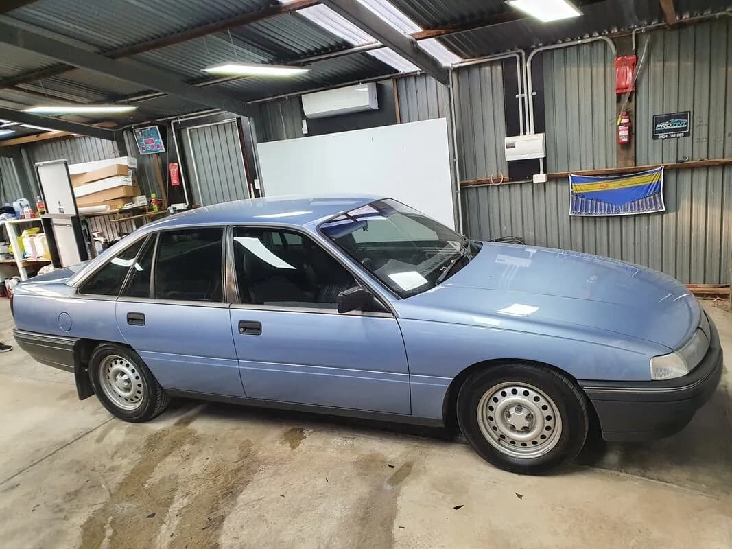 A Holden Commodore in the Pro Tint Adelaide workshop mid tint